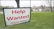  ?? NAM Y. HUH — THE ASSOCIATED PRESS ?? A help wanted sign at Illinois Air Team Test Station in Lincolnshi­re, Ill.