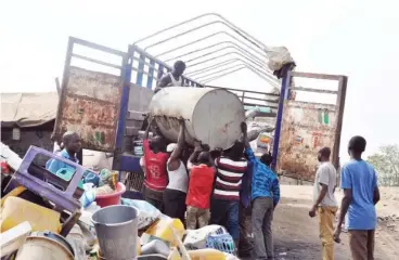  ??  ?? A truck being loaded with scrap at the Gidan Bola in Jabi