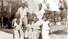  ?? ?? The writer (left below), dressed up for Avurudu as a little girl and with her family--parents, grandparen­ts and brothers at Meewatura