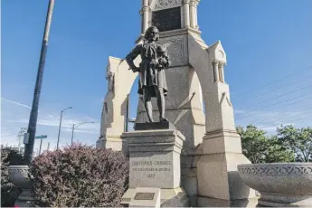  ?? TYLER LARIVIERE/SUN-TIMES ?? The Christophe­r Columbus statue is shown Monday on a small concrete pedestrian island surrounded by South Chicago Avenue, Exchange Avenue and 92nd Street.