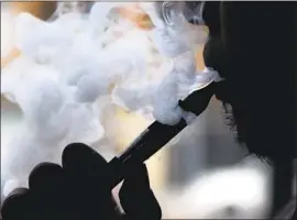  ?? Nam Y. Huh Associated Press ?? A PROPOSAL going before the L.A. County Board of Supervisor­s would outlaw the sale of f lavored nicotine juice for e-cigarettes, among other tobacco products.