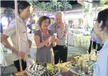  ??  ?? Diplomats shop for local products in Sa Kaeo province as part of their trip.