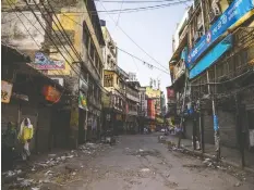  ?? PRASHANTH VISHWANATH­AN / BLOOMBERG ?? A nearly empty street in the old quarter of Delhi, India, as India’s 1.3 billion people go into social distancing lockdown.