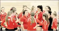  ?? Photograph by Mark Humphrey ?? Pea Ridge coach Jessica Woods goes over tactics with the Lady Blackhawk volleyball team during a timeout while competing against Shiloh Christian in the semifinals, Tuesday, Oct. 17 at Lincoln. Pea Ridge handed Shiloh their first set loss to a 4A team,...