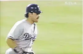  ?? Screenshot­s courtesy of MLB ?? Dodgers catcher Mike Piazza, from top to bottom, sends a pitch by Darren Holmes’ pitch 496 feet over center field at Coors Field in Denver for a two-run home run to put the Dodgers up 7-1 on Sept. 26, 1997.