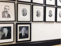  ?? DANIEL J. CHACÓN/NEW MEXICAN FILE PHOTO ?? This 2014 photo shows a wall in City Hall that bears portraits of past Santa Fe mayors. Former Mayor Debbie Jaramillo’s photograph is missing and has yet to be replaced.