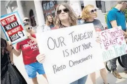  ?? JOHN MINCHILLO/AP ?? Protesters in Dayton, Ohio, express their displeasur­e over President Trump’s planned visit.