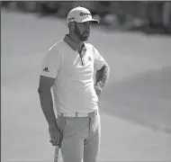  ?? BRIAN CIANCIO/TRIBUNE NEWS SERVICE ?? Dustin Johnson, seen here during the U.S. Open on June 17 at Shinnecock Hills Country Club in Southampto­n, N.Y., missed the cut Friday at the British Open.