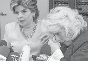  ?? Amanda Lee Myers / Associated Press ?? Heather Kerr, right, a former actress who alleges that entertainm­ent mogul Harvey Weinstein sexually abused her in 1989, wipes her eye as her attorney Gloria Allred speaks to the media Friday in Los Angeles.