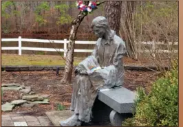  ?? ?? A sculpture of a grieving mother is seen Feb. 21 at a memorial garden in Toms River for children who died from any cause.