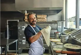  ??  ?? In this small town, Sal Ferranti’s pizzeria serves up more than just delicious pies.