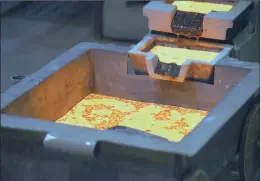  ?? PHOTO: BLOOMBERG ?? Molten gold cools in molds. The recent meltdown in the value of bullion has cost Russia and China combined close to R70 billion in the valuation of their gold reserves.
