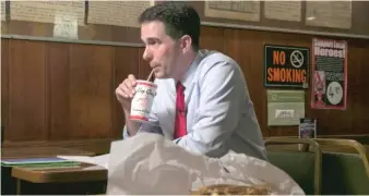  ?? SUN-TIMES FILE PHOTO ?? Wisconsin Gov. Scott Walker relaxes at the Billy Goat Tavern in 2015.