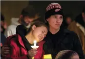  ?? PAUL SANCYA - THE ASSOCIATED PRESS ?? People attending a vigil embrace at LakePoint Community Church in Oxford, Mich., Tuesday. Authoritie­s say a 15-year-old sophomore opened fire at Oxford High School, killing several students and wounding multiple other people, including a teacher.