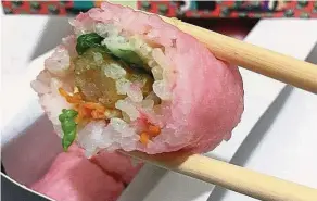  ?? — ANN ?? One of Maki-San chain’s signature rolls, Keep On Shrimpin’ comes wrapped in a pink soy wrap.