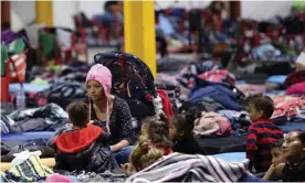  ?? Photograph: Jerry Lara/AP ?? A Honduran woman, Delia Romero, with her children in their sleeping area at a shelter in Piedras Negras, Mexico, in February 2019.