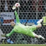  ?? MATTHIAS SCHRADER — THE ASSOCIATED PRESS ?? England goalkeeper Jordan Pickford saves a penalty kick.