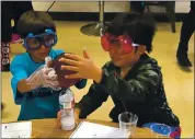  ?? CAROLYN JONES — EDSOURCE FILE ?? Elementary school students work through a science activity.