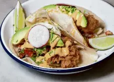  ?? Cesar Hernandez/The Chronicle ?? Fish tacos from San Francisco’s Woodhouse Fish Co., which devotes itself to all things oceanic.