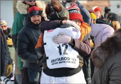  ?? Photo by Megan Gannon ?? YOU MADE IT!— Barb Redington greets Hunter Keefe as he finished his first Iditarod in 11th place on March 15.