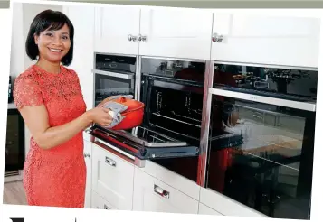  ??  ?? Kitchen treats: Tiffany, far left, and Nicky are proud of their gleaming cookers