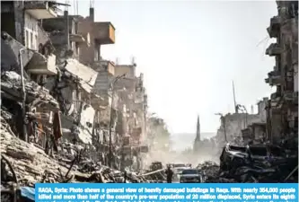  ??  ?? RAQA, Syria: Photo shows a general view of heavily damaged buildings in Raqa. With nearly 354,000 people killed and more than half of the country’s pre-war population of 20 million displaced, Syria enters its eighth year of war, free of the jihadist...