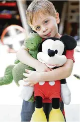  ??  ?? Brady Blackburn, 3, made sure his parents saved certain important stuffed animals from the floodwater­s in their Kingwood home.