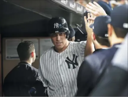  ?? FRANK FRANKLIN II — THE ASSOCIATED PRESS ?? The New York Yankees' Aaron Judge celebrates with teammates after hitting three- run home run during the sixth inning of a baseball game against the Baltimore Orioles on Sept. 14in New York.