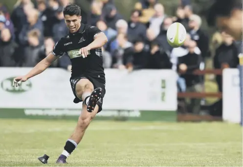  ??  ?? 0 Young stand-off Adam Hastings kicks for goal during a fine performanc­e for Glasgow against Northampto­n Saints.