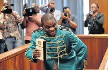  ?? Picture: EUGENE COETZEE ?? HIGH DRAMA: Nigerian pastor Timothy Omotoso in the Port Elizabeth High Court wearing an outfit inspired by British pop group The Beatles