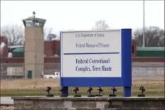  ?? Michael Conroy/Associated Press ?? A guard tower flanks the sign at the entrance to the U.S. Penitentia­ry in Terre Haute, Ind. Three people are scheduled to die by lethal injection in one week at USP Terre Haute beginning Monday.