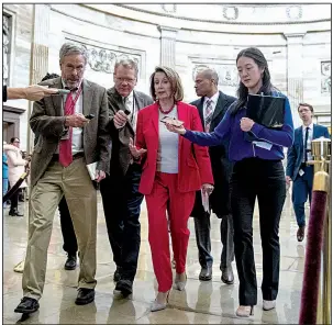  ?? AP/ANDREW HARNIK ?? House Speaker Nancy Pelosi leaves a meeting with furloughed workers Wednesday on Capitol Hill as a bipartisan group of senators sought support for a letter calling for an end to the government shutdown.