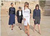  ??  ?? President Trump prayed at Jerusalem’s Western Wall before inserting a note between the stones, right. He was accompanie­d by his wife Melania and daughter Ivanka, left