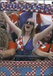  ?? Darko Vojinovic/Associated Press ?? Croatia supporters wait to welcome the soccer team on its arrival Monday in Zagreb, Croatia.