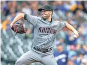  ?? TOM LYNN/AP ?? Diamondbac­ks starter Robbie Ray pitches during the first inning of Thursday’s game against the Brewers. Ray pitched seven strong innings in the win.