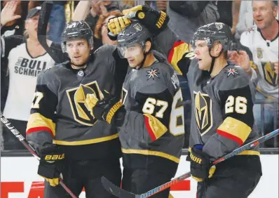  ?? PHOTOS BY JOHN LOCHER / AP ?? Golden Knights defenseman Shea Theodore, left, and center Paul Stastny, right, celebrate after left wing Max Pacioretty, center, scores Sunday in a preseason game against the San Jose Sharks. The Golden Knights begin regular-season play at 7 p.m. today at T-mobile Arena.