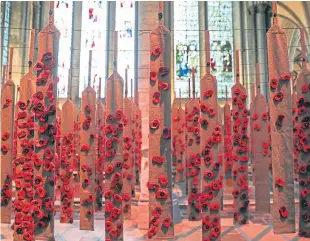  ?? PA. ?? Poppies attached to puttees, leg wrappings worn by soldiers during World War 1, hang down in the Morning Chapel inside Salisbury Cathedral.