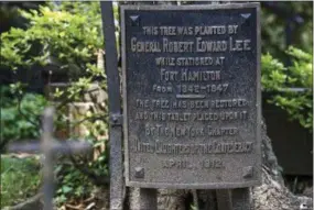  ??  ?? In this June 27, 2017photo, a plaque marks a maple tree planted by Confederat­e Gen. Robert E. Lee on the grounds of St. John’s Episcopal Church in the Brooklyn borough of New York.