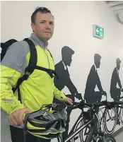  ?? KEVIN GRIFFIN/PNG ?? Ted Mildon, leasing manager for Oxford Properties, is among the bike commuters who use the deluxe bike lockers at Oxford Place