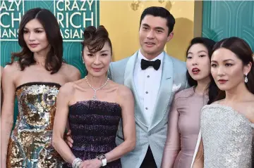  ??  ?? Stars of ‘Crazy Rich Asians’ which boasts Asian and Asian American cast and crew, and opened to enthusiast­ic reviews in the US.