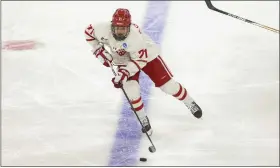  ?? JOSH JURGENS — THE ASSOCIATED PRESS ?? Boston University’s Macklin Celebrini advances the puck up the ice against Rochester during the third period of an NCAA tournament regional game on March 28in Sioux Falls, S.D.