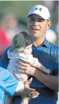  ?? AP ?? Gary Woodland holds his son Jaxson after winning the Phoenix Open.