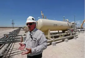  ?? Steve Gonzales / Houston Chronicle ?? “Out in an area like this, trying to get trucks down these roads, it’d tear them to pieces, and tear up the roads, too,” said Russ True, Permian Basin manager for Noble Midstream Partners. “… I’m glad we took those trucks off the road.”