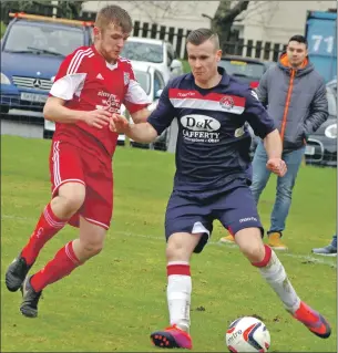  ??  ?? Match report and photograph­s: Derek Black. Paul Carmichael shields the ball from Fraser Murray.