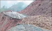  ?? HT PHOTO ?? A section of the Jammu-srinagar national highway that was swept away by a massive landslide in Dalwas area near Batote in Ramban district on Tuesday.