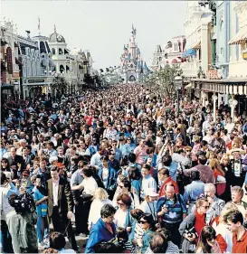  ??  ?? Crowds pictured on opening day at Euro Disneyland near Paris.