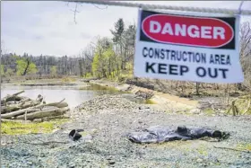  ??  ?? The Ida Lake Dam in Troy is almost 30 years old. Last year, the city removed part of the dam to protect downstream properties. The timber dam is near Pawling Avenue and Congress Street.