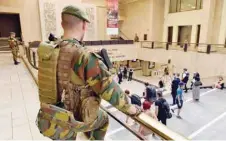  ?? — Reuters ?? Belgian soldiers stand guard in central station in Brussels.