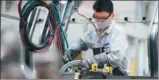  ?? XINHUA ?? A worker performs a soldering job at an auto manufactur­ing plant in Xi’an, capital of Shaanxi province.