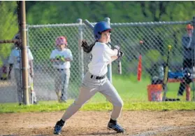  ??  ?? Grace Parcover, 13, has her turn at bat.